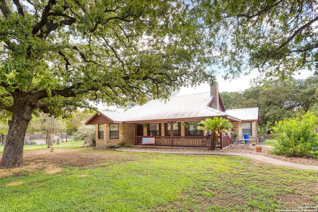 back of property with a lawn