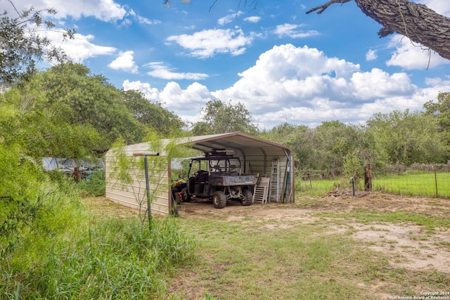 view of yard with a carport