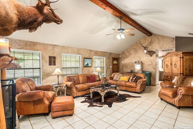 tiled living room featuring ceiling fan and lofted ceiling with beams