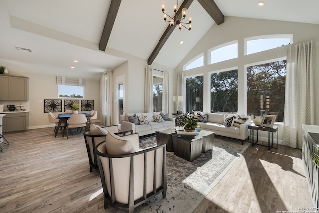 living room featuring beamed ceiling, dark hardwood / wood-style flooring, high vaulted ceiling, and an inviting chandelier