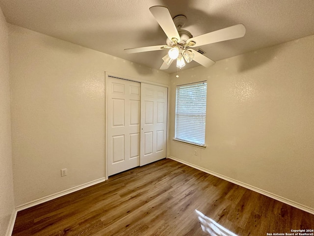 330 Agency Oaks, San Antonio, TX 78249 - unfurnished bedroom with wood finished floors, baseboards, a closet, and a ceiling fan