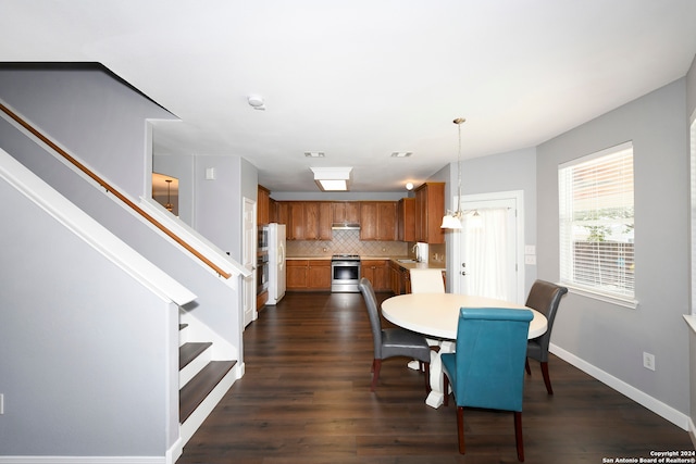 dining room featuring dark hardwood / wood-style flooring and sink