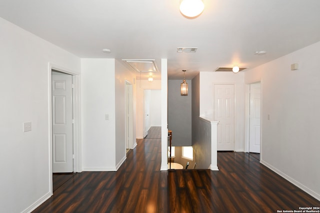 unfurnished room with dark hardwood / wood-style floors