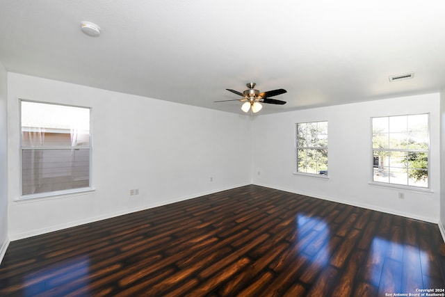 empty room featuring dark hardwood / wood-style floors and ceiling fan