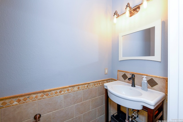 bathroom with tile walls