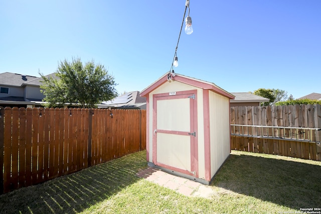 view of outbuilding featuring a yard