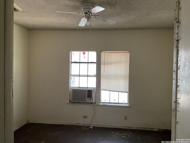 5222 Lark, San Antonio, TX 78228 - unfurnished room with a textured ceiling, cooling unit, and ceiling fan