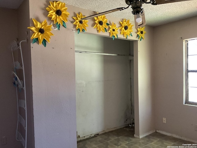 5222 Lark, San Antonio, TX 78228 - unfurnished bedroom featuring multiple windows and a textured ceiling
