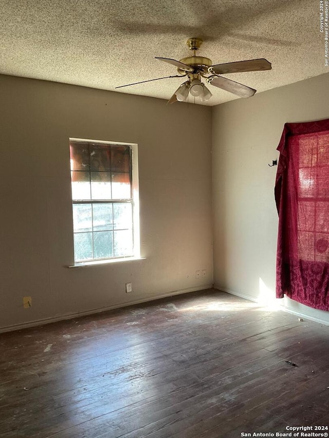 5222 Lark, San Antonio, TX 78228 - empty room featuring wood-type flooring, a textured ceiling, a ceiling fan, and baseboards