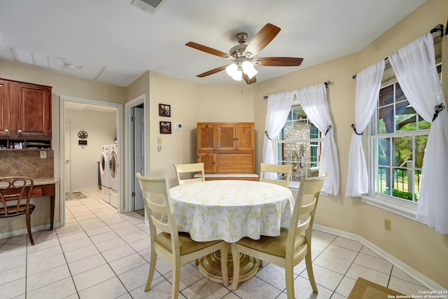 dining area with washing machine and clothes dryer, ceiling fan, and light tile patterned flooring