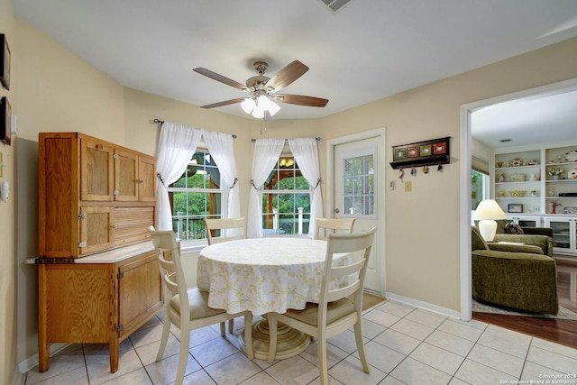 dining space featuring ceiling fan and light hardwood / wood-style flooring