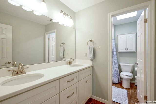 bathroom featuring hardwood / wood-style floors, vanity, and toilet