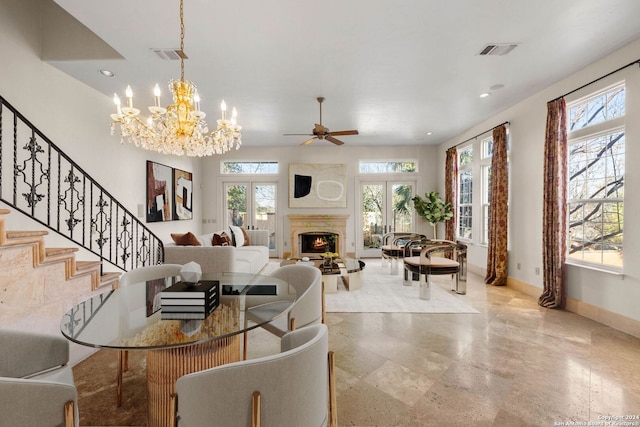 living room featuring ceiling fan and french doors