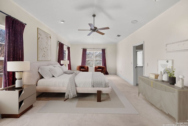 bedroom with light colored carpet and ceiling fan