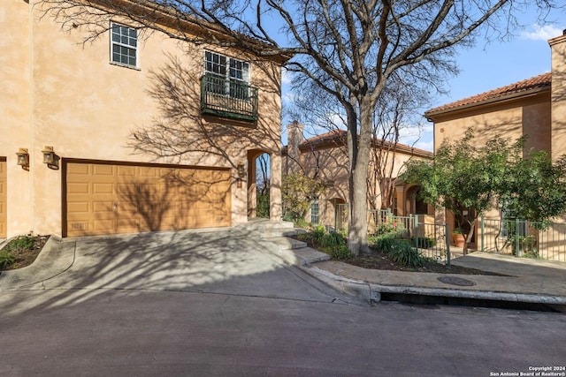 mediterranean / spanish house with a garage