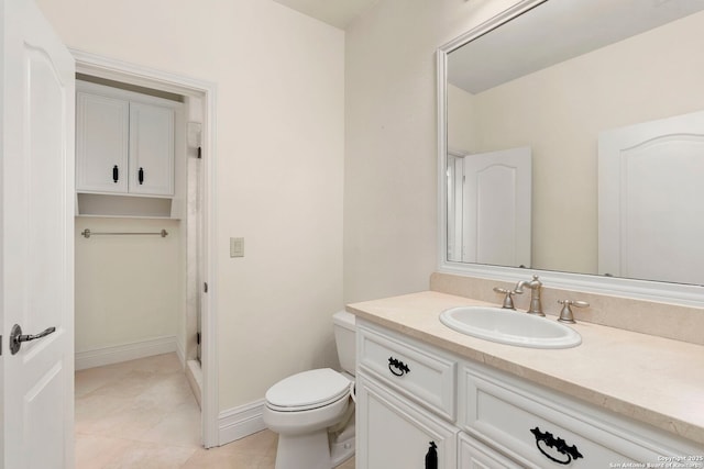 bathroom with vanity, an enclosed shower, tile patterned floors, and toilet