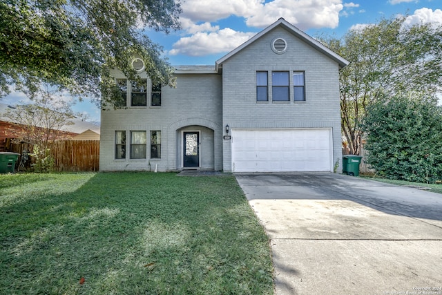 view of front property with a garage and a front yard