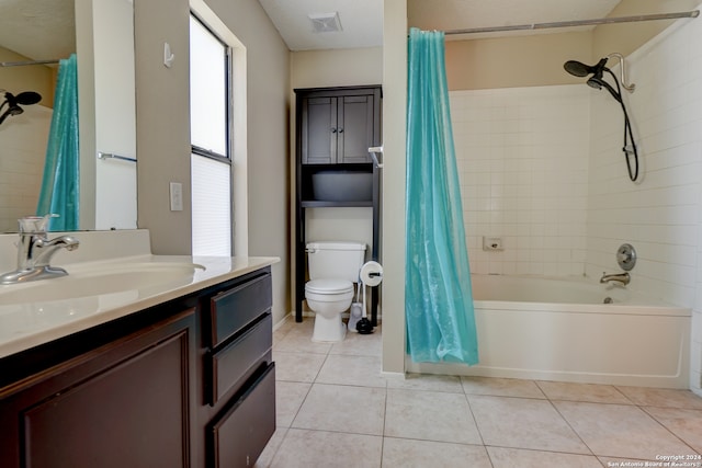 full bathroom featuring tile patterned flooring, shower / bath combination with curtain, toilet, and vanity