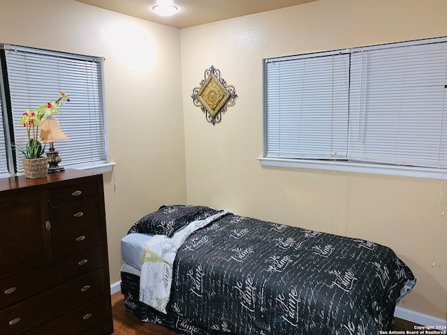 bedroom featuring dark hardwood / wood-style floors