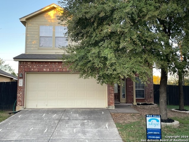 obstructed view of property featuring a garage