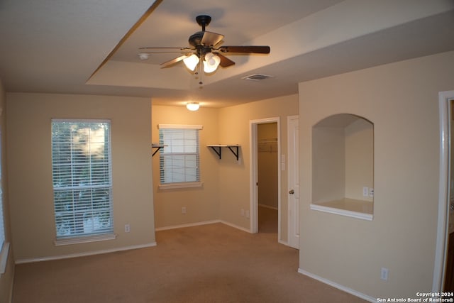 carpeted empty room with ceiling fan