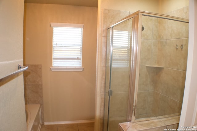 bathroom with plus walk in shower and tile patterned floors