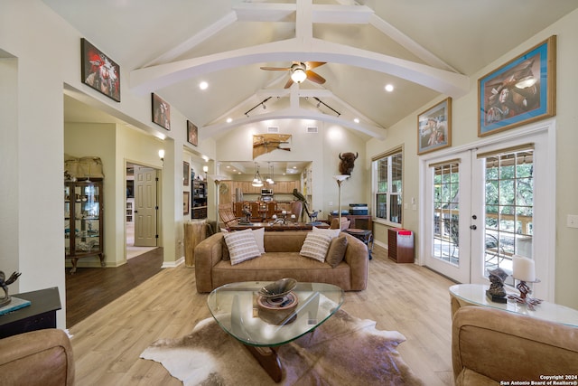 living room featuring french doors, ceiling fan, high vaulted ceiling, beamed ceiling, and light hardwood / wood-style floors