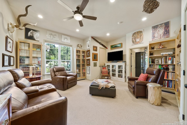 living room with light colored carpet and ceiling fan