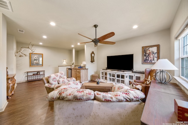 living room with dark hardwood / wood-style floors and ceiling fan