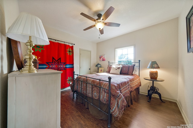 bedroom featuring dark hardwood / wood-style floors and ceiling fan