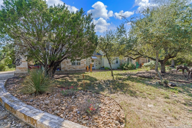 view of property hidden behind natural elements