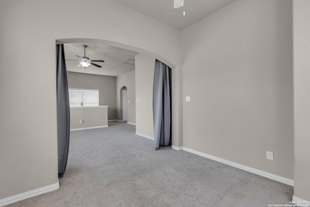 carpeted empty room featuring ceiling fan