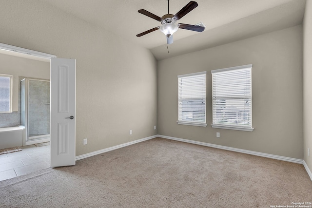 unfurnished room featuring light carpet, ceiling fan, and lofted ceiling