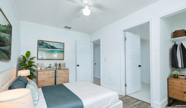 bedroom featuring light hardwood / wood-style flooring and ceiling fan