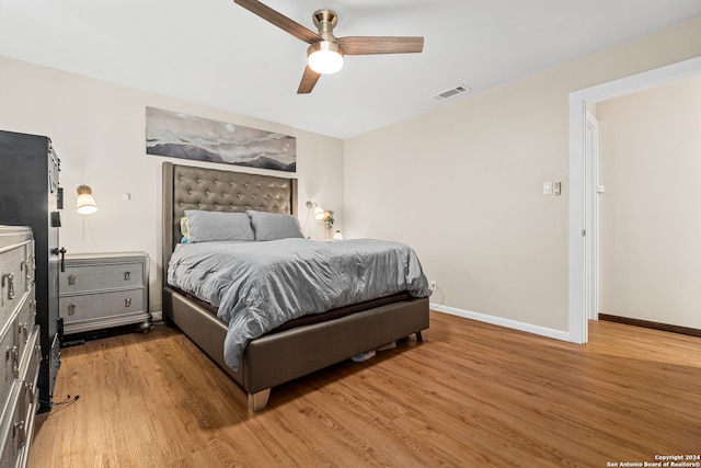 bedroom featuring ceiling fan and light hardwood / wood-style floors