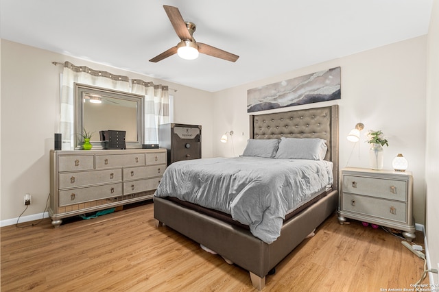 bedroom with ceiling fan and light hardwood / wood-style flooring