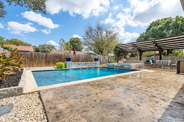 view of swimming pool with a patio area and an in ground hot tub