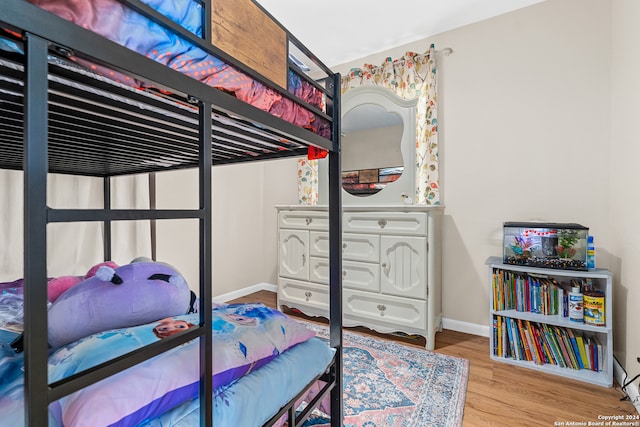 bedroom with hardwood / wood-style floors