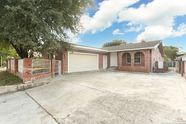 ranch-style house featuring a garage