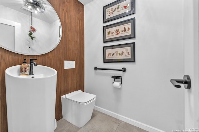 bathroom with tile patterned flooring and toilet