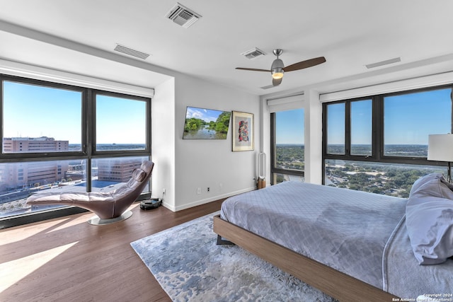 bedroom featuring ceiling fan and dark wood-type flooring