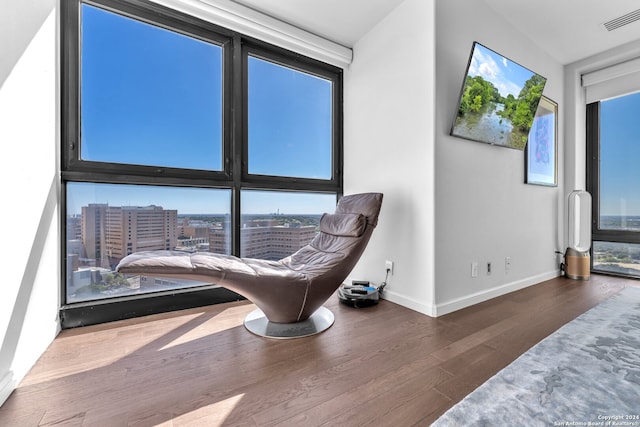 sitting room with dark hardwood / wood-style flooring