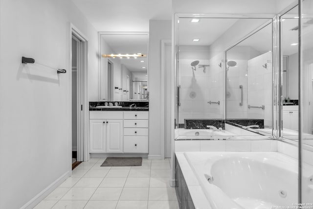 bathroom with tile patterned floors, vanity, and separate shower and tub