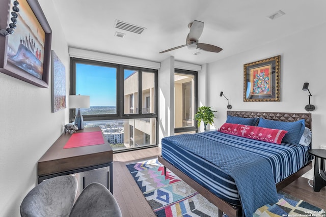 bedroom featuring hardwood / wood-style flooring and ceiling fan