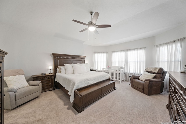 bedroom featuring ceiling fan and light colored carpet