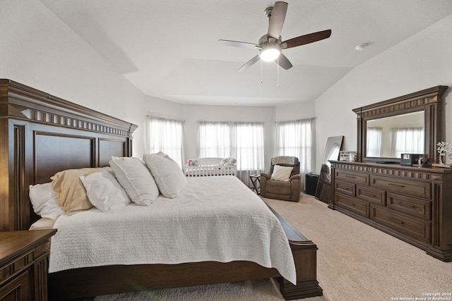 carpeted bedroom featuring ceiling fan and vaulted ceiling