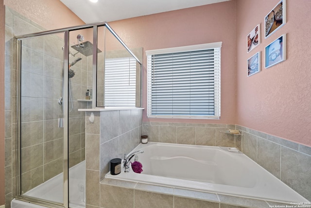 bathroom with separate shower and tub