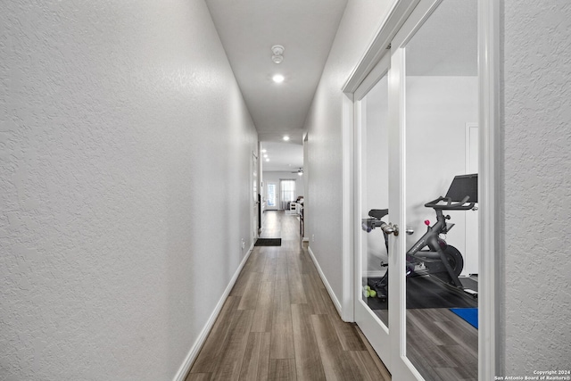 corridor featuring wood-type flooring