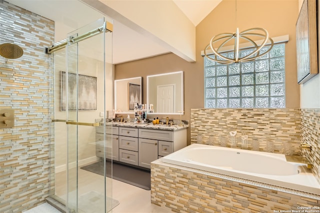 bathroom with vanity, separate shower and tub, a notable chandelier, tile patterned flooring, and lofted ceiling