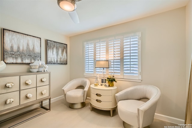 sitting room featuring ceiling fan